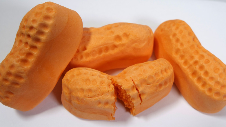 four circus peanuts on a white background