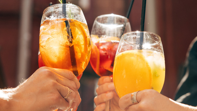 Cheers with four aperitifs