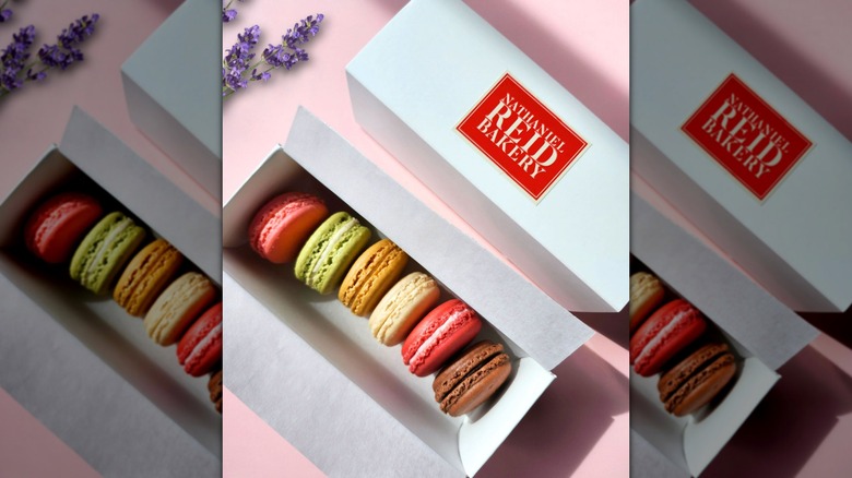 Colorful macarons in cardboard display box