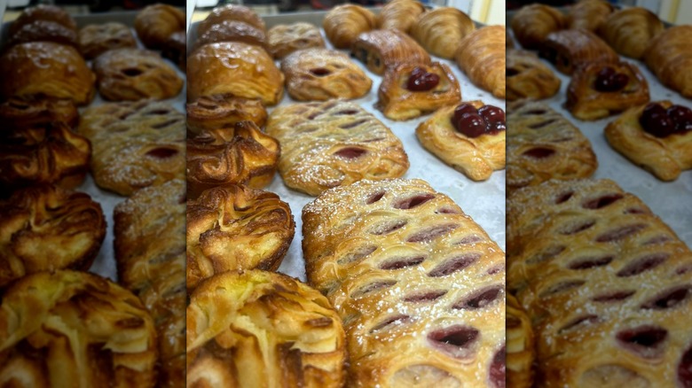Various fruity pastries on display on bakery
