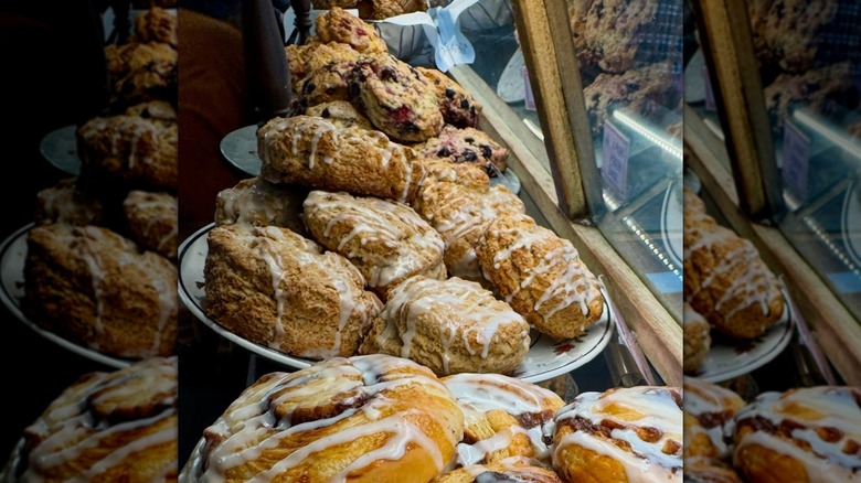 Various baked goods on display in bakery cabinet