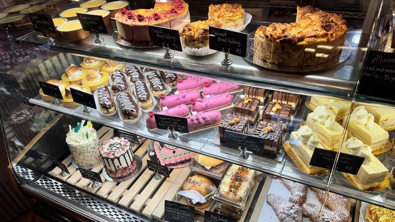 Various bakes on display in glass-fronted bakery cabinet