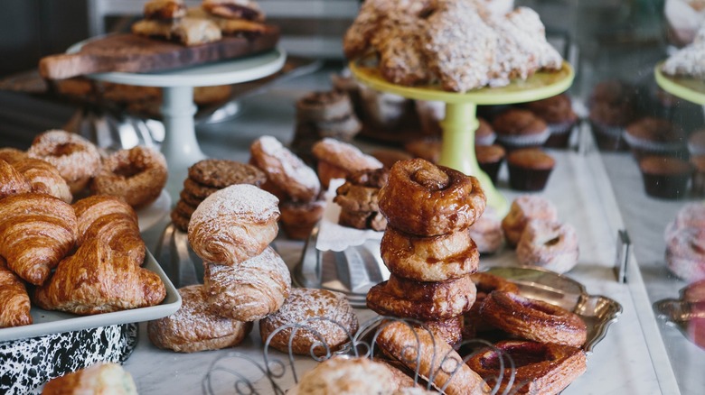 Various baked goods on display on bakery counter