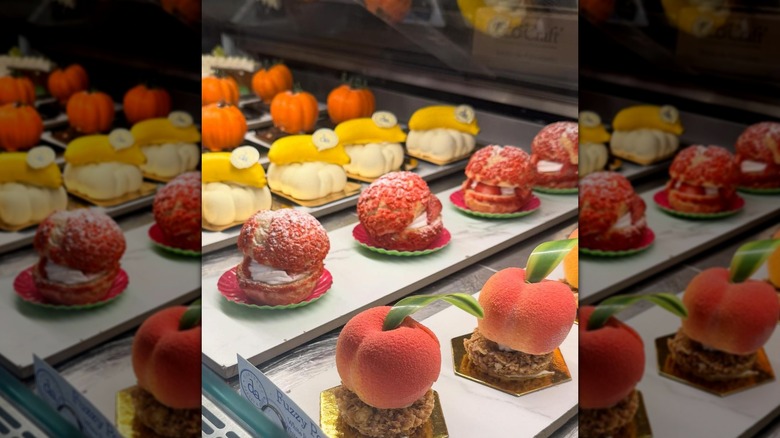 Beautifully-crafted fruit-shaped desserts in bakery display
