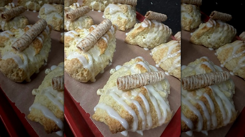 Glazed scones on parchment-lined tray