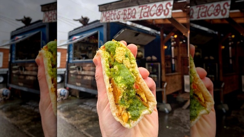 barbecue taco in hand