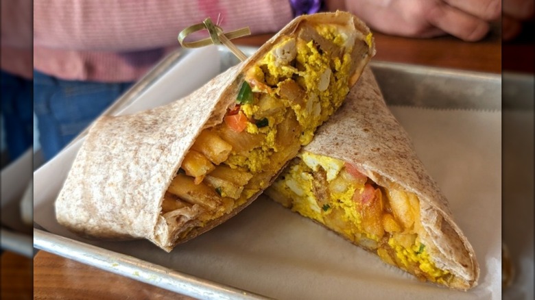Chicken and egg breakfast wrap on a plate