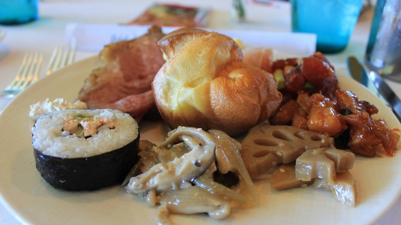 Brunch plate with sushi roll and assorted bites