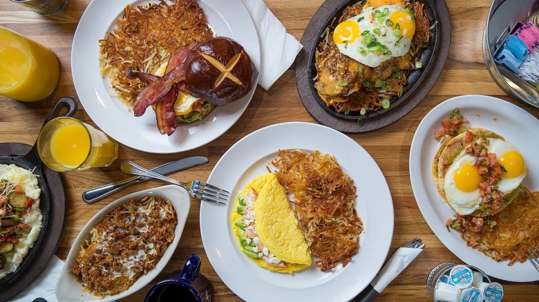 Assortment of brunch dishes with omelets, eggs, and potatoes from above