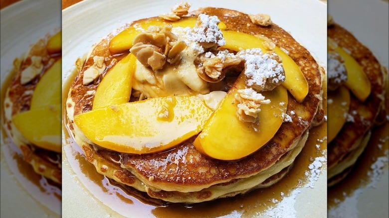 Pancakes with slices of fresh peaches