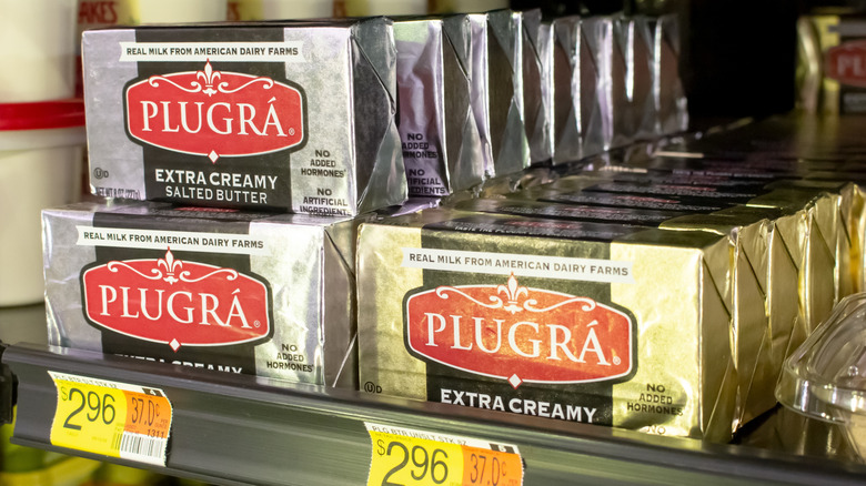 bars of Plugra butter on shelf
