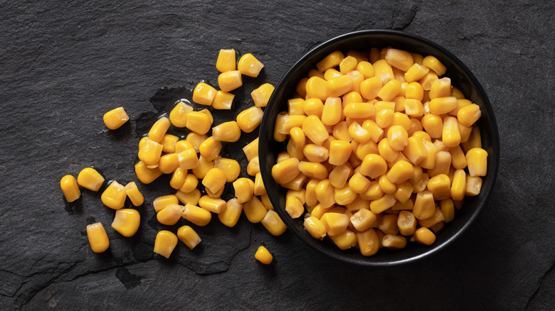 Bowl of cooked corn kernels black