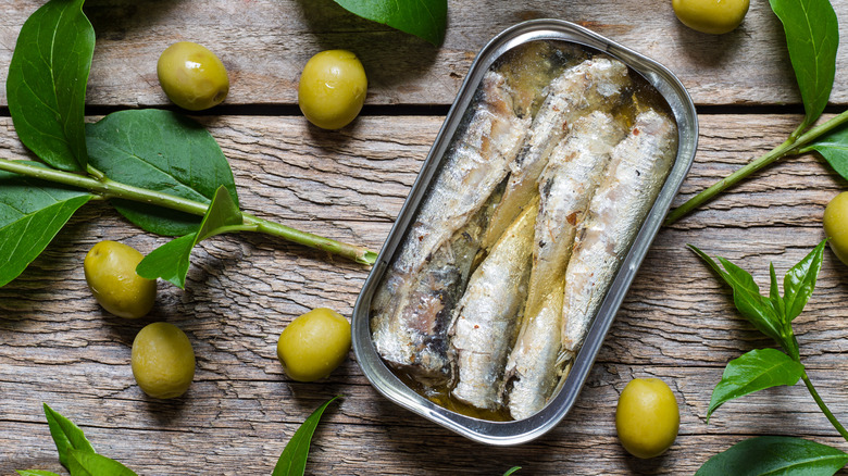 Open can sardines in olive oil
