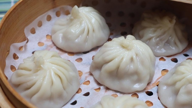 Soup dumplings in a bamboo steamer