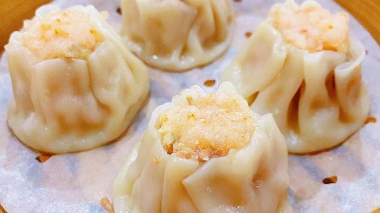 dim sum dumplings in a bamboo steamer