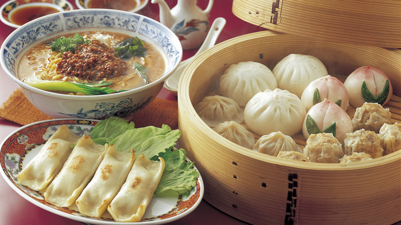 Dan dan noodles with soup and dim sum dishes