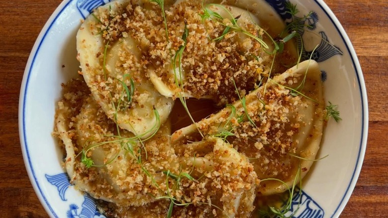 Brown butter, lemon, yuzu kosho gremolata, and dill pierogis