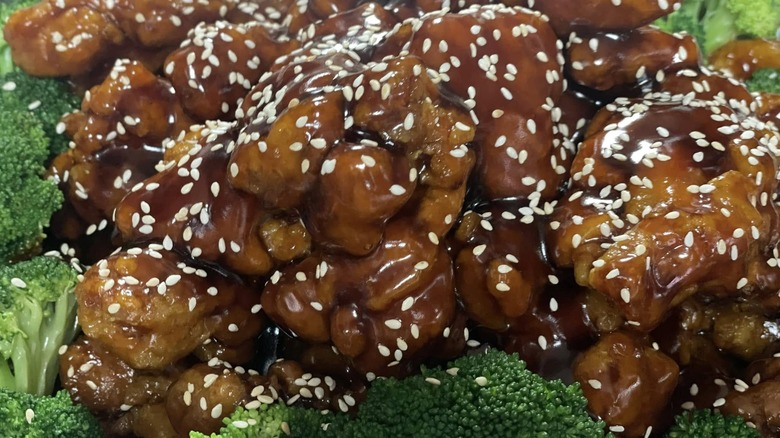 Sesame chicken surrounded by broccoli