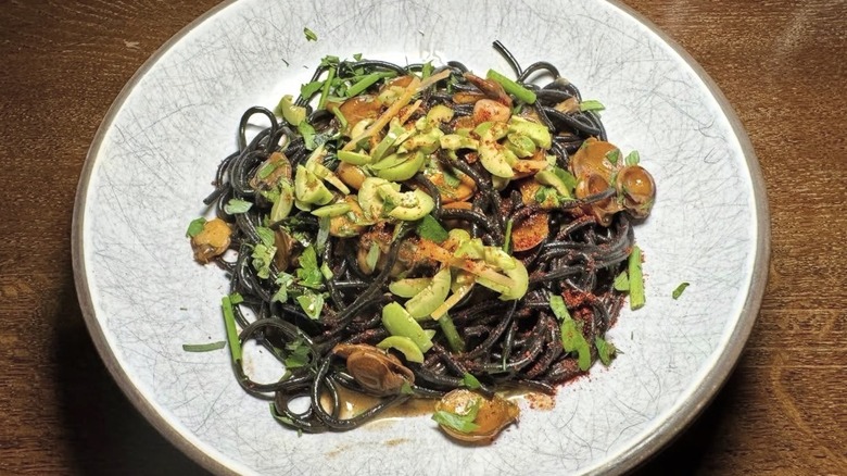 Spaghetti nero with slipper limpets, castelvetrano olives, preserved lemon, mint, green crab sauce at The Shipwright's Daughter