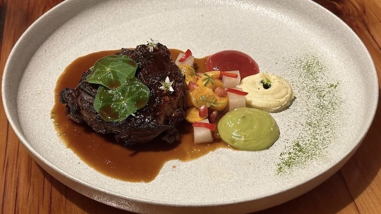 Lamb osso bucco with gooseberry, parsnip, green goddess, rhubarb shrub at Bardea Food & Drink