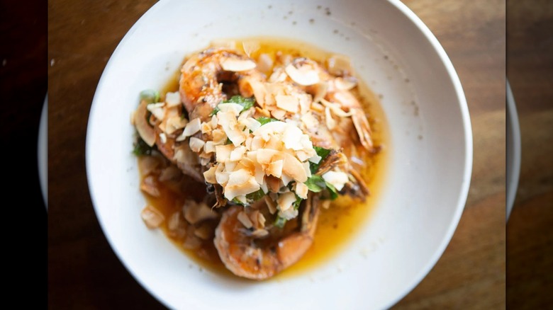 Shrimp dish served on a white plate at Fête in Honolulu