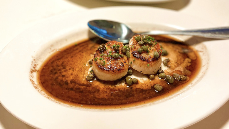 Scallops with capers and brown butter served at Pulito Osteria