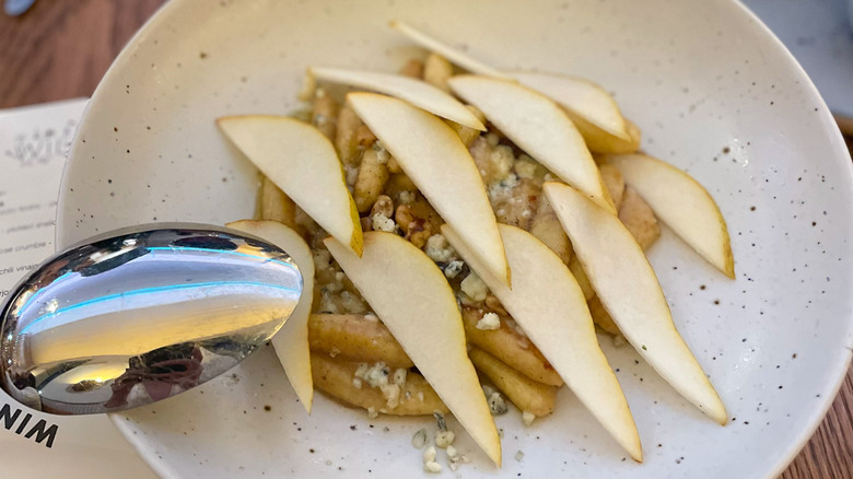 Potato gnocchi with walnut-cider emulsion, blue cheese, pear, thyme, and brown butter at Wildweed in Cincinnati