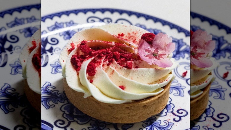 A tart with a flower garnish served at Skogen Kitchen in Custer, South Dakota