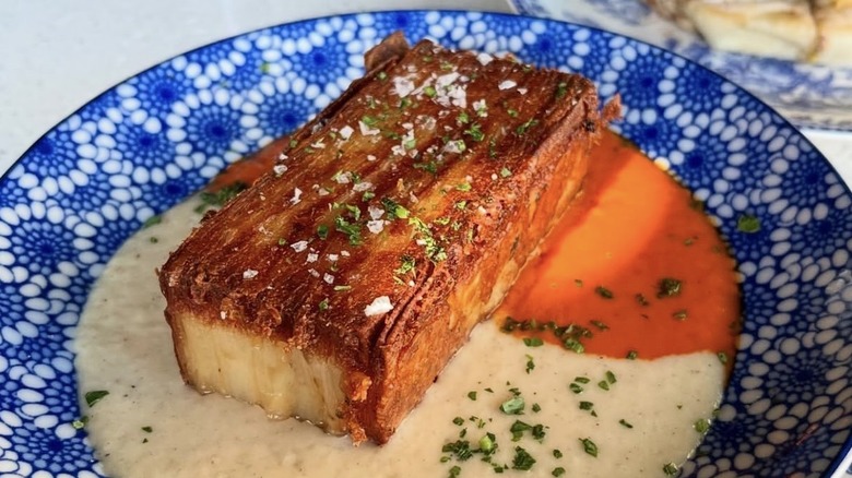 Batatas bravas with layered crispy potatoes, bravas sauce, and smoked manchego at Lonely Siren
