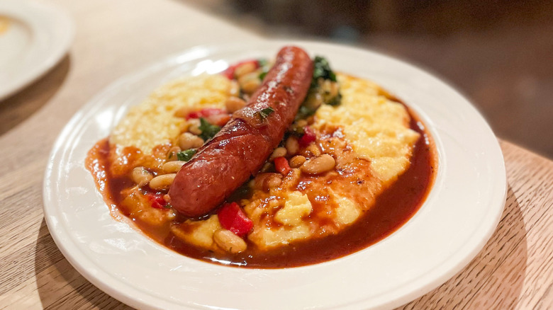 Pork sausage with kale, polenta, and cannellini beans at Snallygaster's Cafe & Wine Bar