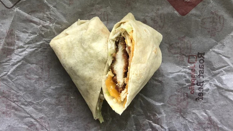 Arby's chicken ranch wrap sitting on top of wrapper