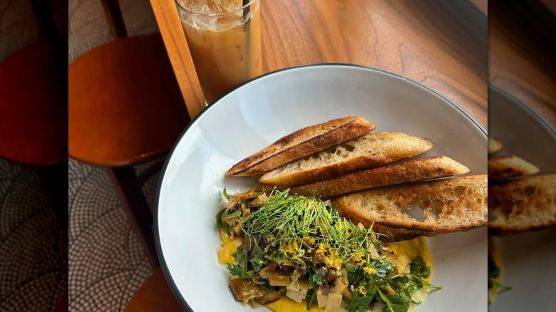 Leek toast on plate with greens