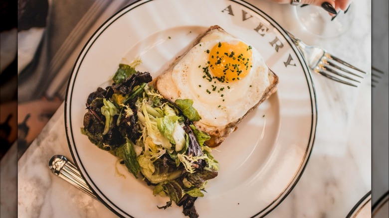 Croque Madame on Avery-branded plate with greens