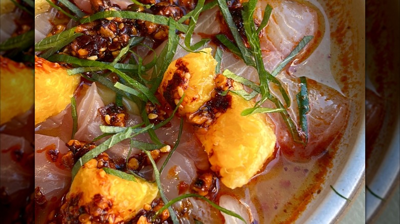 Kanpachi crudo with ponzu, salsa macha, orange and shiso