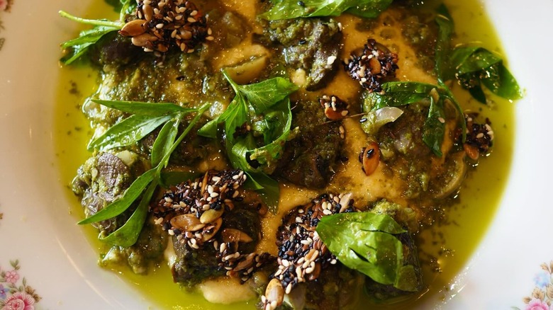 Escargot in sauce with basil