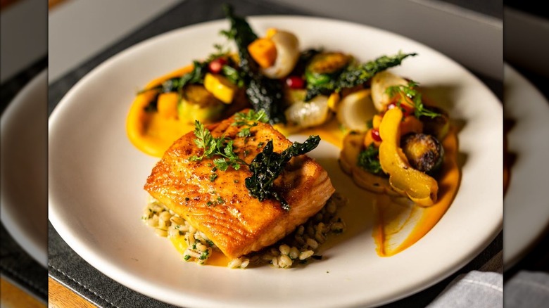 Salmon and heirloom squash with barley, kale, and sumac