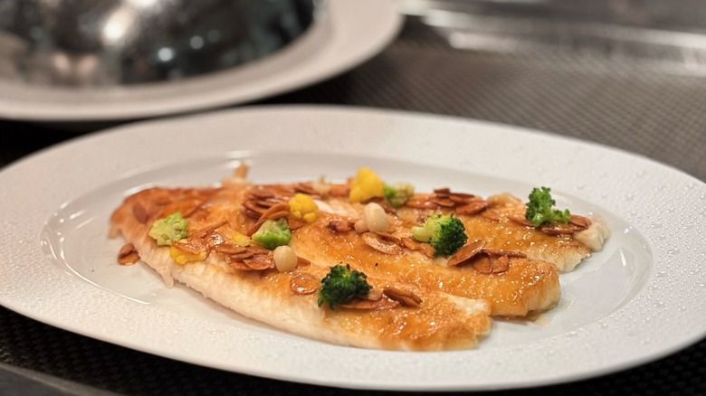 Pan-seared sole on white plate