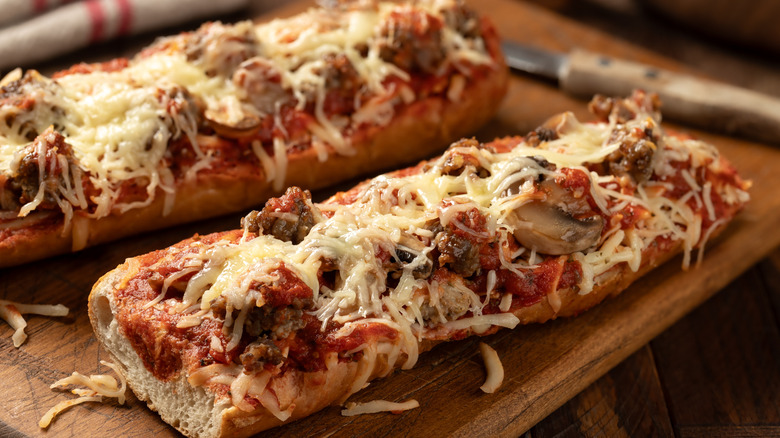 Top-view of fully-loaded French bread pizzas