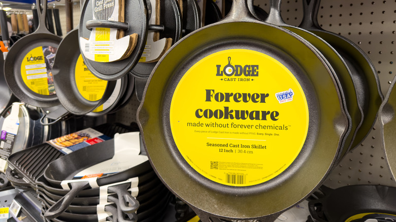 Lodge cast iron skillets hanging in the store