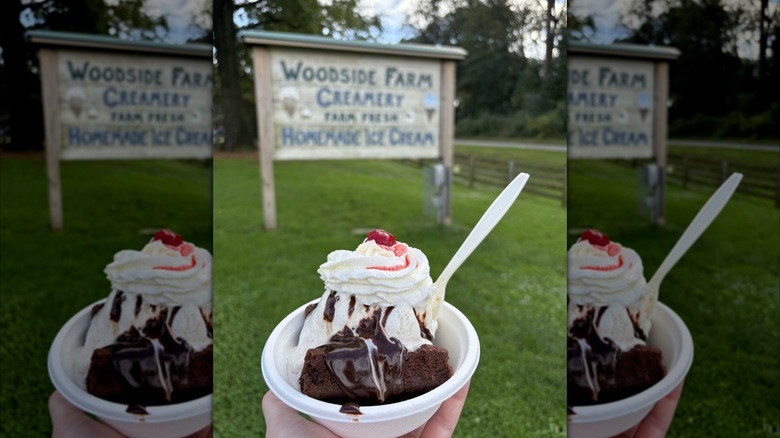 Brownie sundae with vanilla ice cream, whipped cream, hot fudge, and a cherry