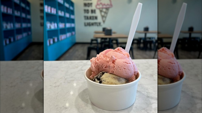 Strawberry ice cream and milk n cookies dough in bowl with spoon
