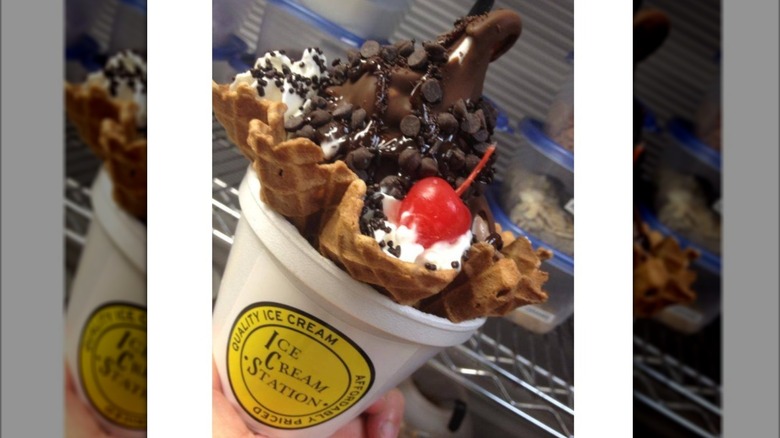 Waffle bowl with ice cream, chocolate, and cherry on cup
