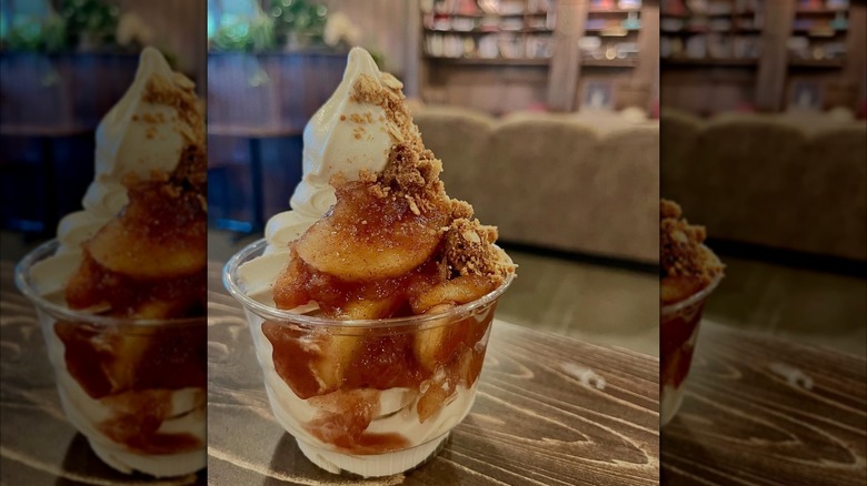 Apple pie creemee sundae in clear plastic cup on table