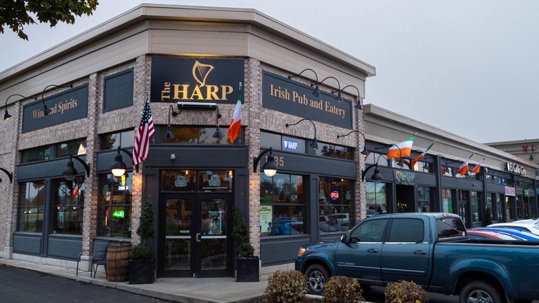Exterior of The Harp with cars parked outside