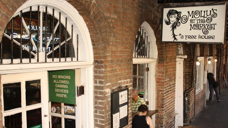 Exterior brick building with Molly's at the Parket sign and arched windows