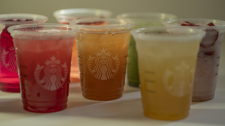 Multiple multicolored Starbucks drinks