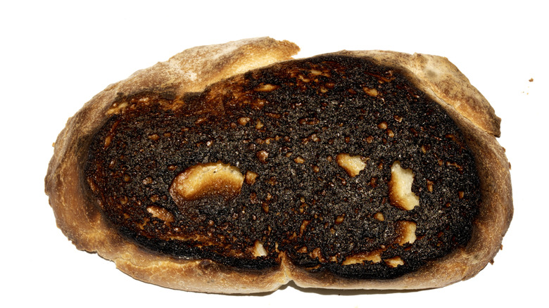 The dark bottom of a loaf of bread