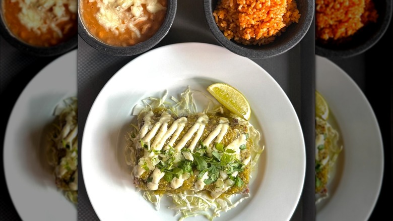 Chile verde with smoked pork ribs and sides of beans and rice