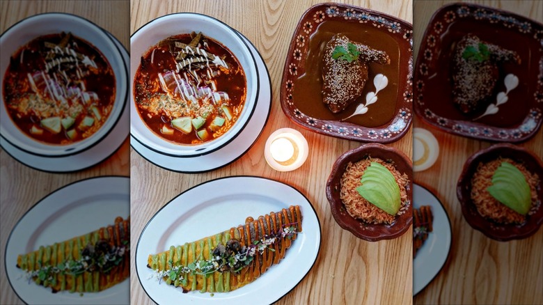 Assorted Mexican dishes on wooden table