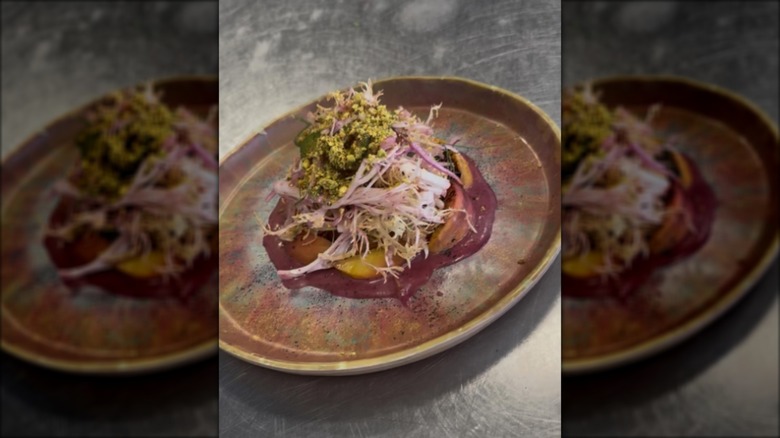 Peach and fennel summer dish on brown plate